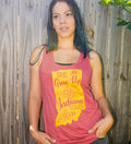 A woman wearing a vintage red racerback tank top with text and a graphic related to Indiana on it, standing against a fence.